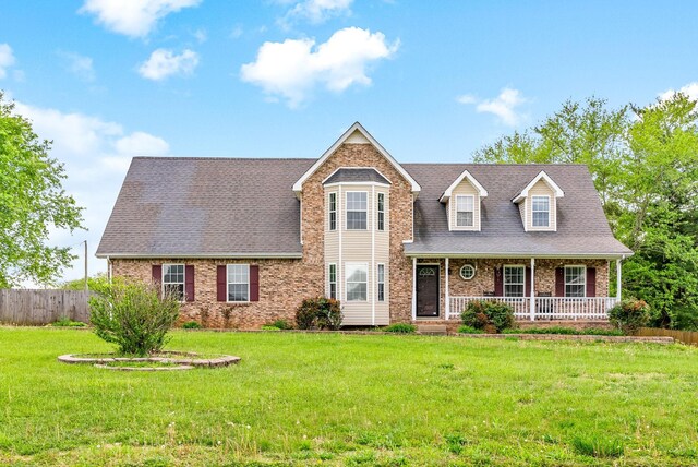 2413 Tana Way, Clarksville, TN 37042 - view of front of home featuring roof with shingles, a front lawn, covered porch, fence, and brick siding