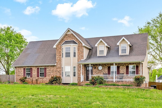 2413 Tana Way, Clarksville, TN 37042 - view of front of home featuring brick siding, a porch, a front yard, and fence