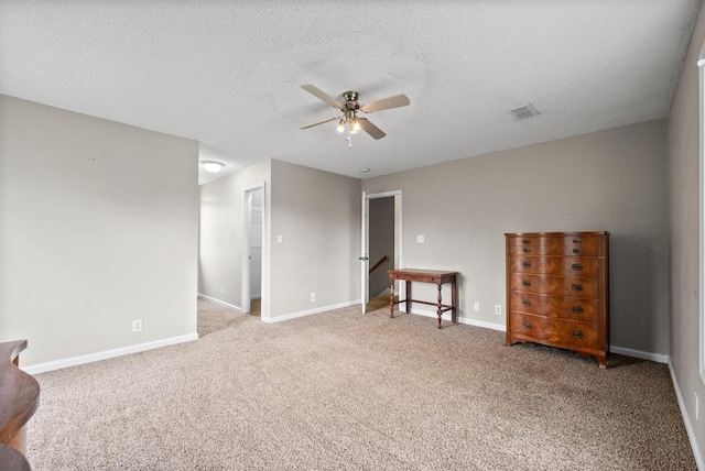 2413 Tana Way, Clarksville, TN 37042 - carpeted spare room with baseboards, a ceiling fan, a textured ceiling, and visible vents