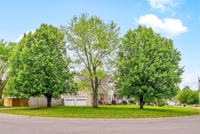 2413 Tana Way, Clarksville, TN 37042 - obstructed view of property featuring a garage, a front yard, and fence