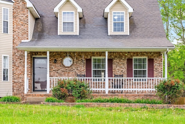 2413 Tana Way, Clarksville, TN 37042 - cape cod home with brick siding, a shingled roof, and covered porch