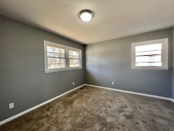 210 Ragan St, Tullahoma, TN 37388 - unfurnished room with a wealth of natural light, carpet floors, and baseboards
