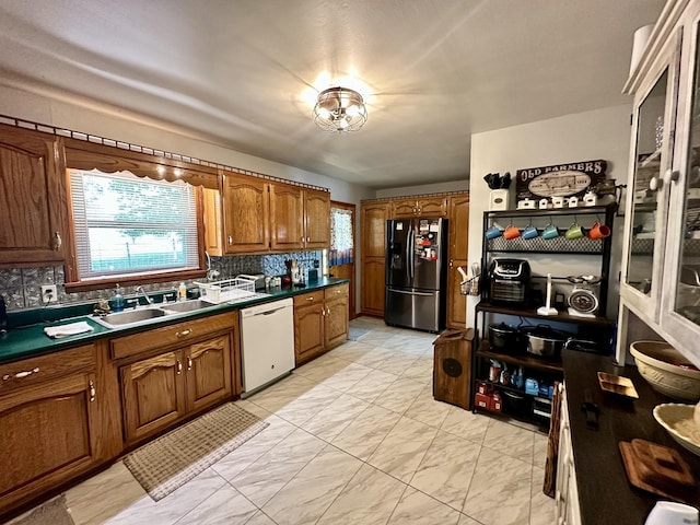 946 Monument Rd, Summertown, TN 38483 - kitchen with black refrigerator with ice dispenser, tasteful backsplash, a sink, dishwasher, and marble finish floor