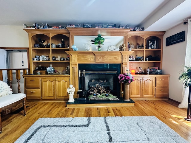 946 Monument Rd, Summertown, TN 38483 - living area with a fireplace with raised hearth and light wood-type flooring