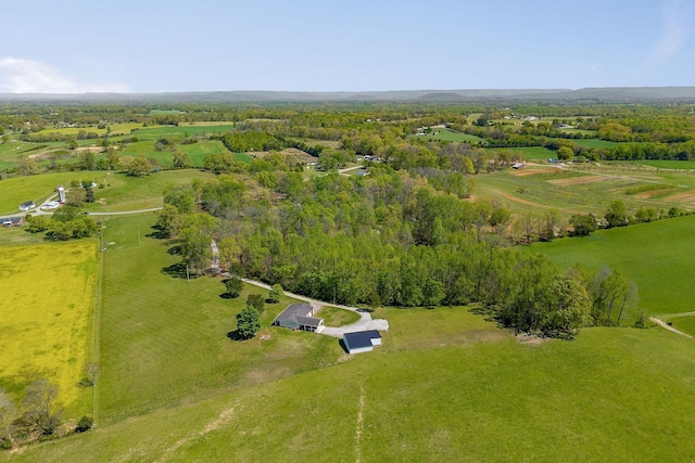 aerial view with a rural view and a wooded view