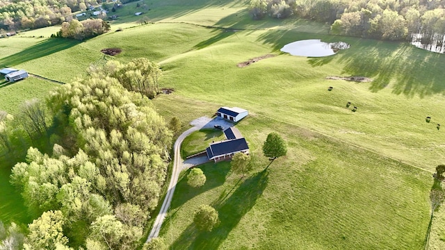 birds eye view of property with a rural view