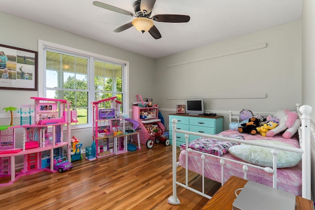 bedroom with ceiling fan and wood finished floors