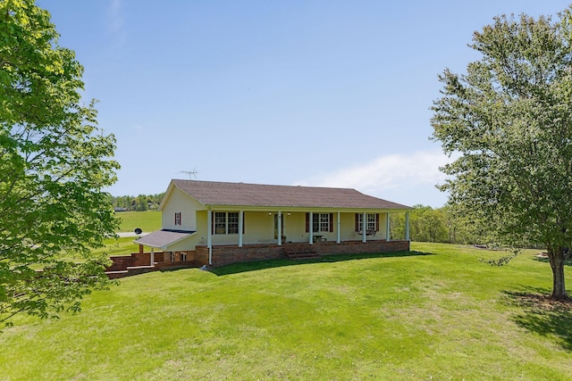 single story home featuring a porch and a front yard