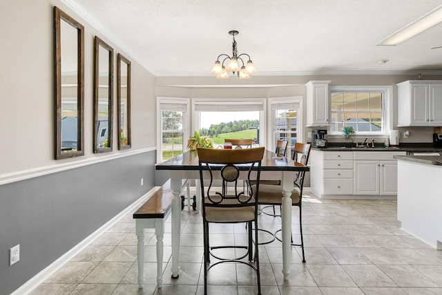 dining space with a wealth of natural light, crown molding, and a notable chandelier