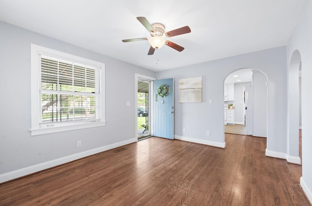 120 39th Ave N, Nashville, TN 37209 - interior space with a ceiling fan, wood finished floors, arched walkways, baseboards, and visible vents