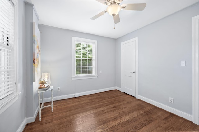 120 39th Ave N, Nashville, TN 37209 - unfurnished bedroom featuring baseboards, wood finished floors, and ceiling fan