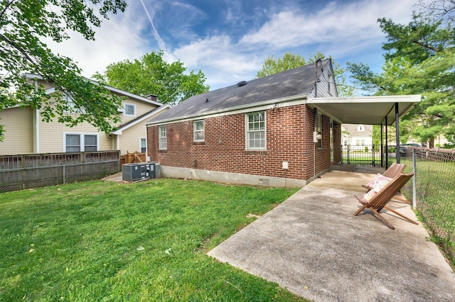 120 39th Ave N, Nashville, TN 37209 - back of house with central AC, driveway, a yard, and a fenced backyard