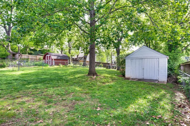 120 39th Ave N, Nashville, TN 37209 - view of yard featuring a storage shed, a fenced backyard, and an outdoor structure