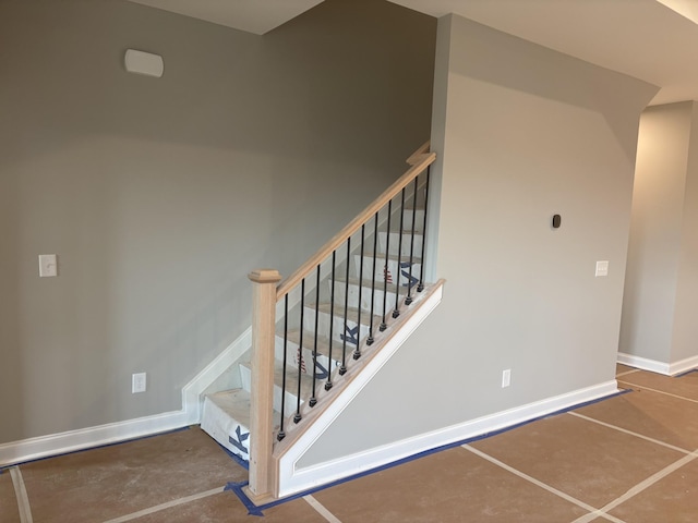 staircase with baseboards