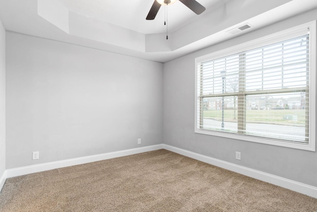 159 Matheson Dr, Clarksville, TN 37043 - carpeted spare room featuring a tray ceiling, visible vents, a ceiling fan, and baseboards