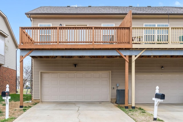 159 Matheson Dr, Clarksville, TN 37043 - exterior space with an attached garage, a wooden deck, and driveway