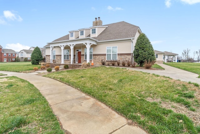 159 Matheson Dr, Clarksville, TN 37043 - view of front facade with stone siding, a front lawn, covered porch, and a shingled roof