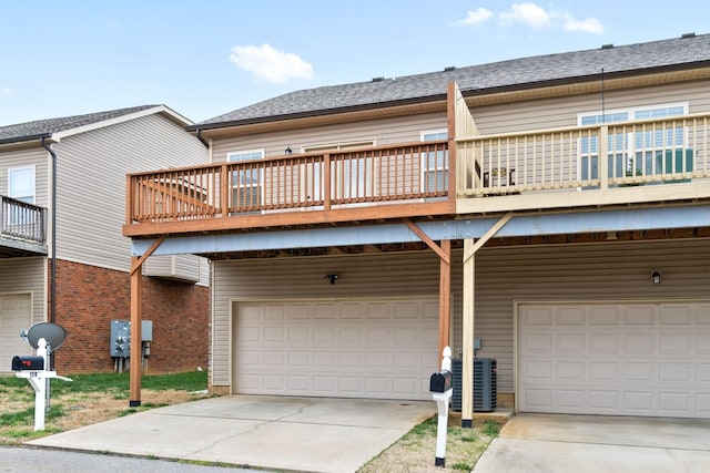 159 Matheson Dr, Clarksville, TN 37043 - view of front of home featuring driveway, a deck, cooling unit, and a garage