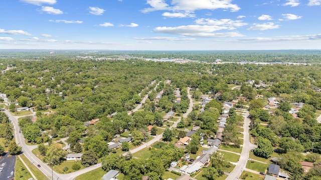 birds eye view of property featuring a forest view