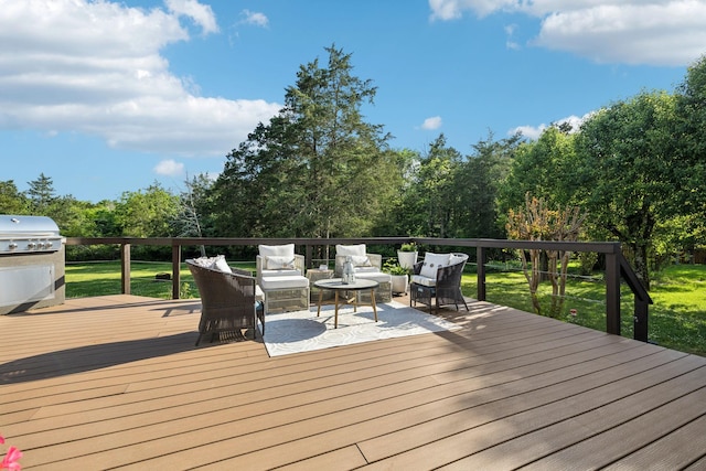 wooden terrace featuring a yard, grilling area, and outdoor lounge area