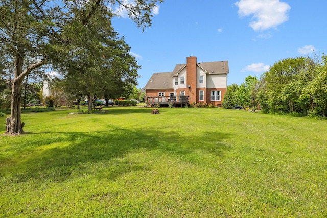 view of yard featuring a wooden deck