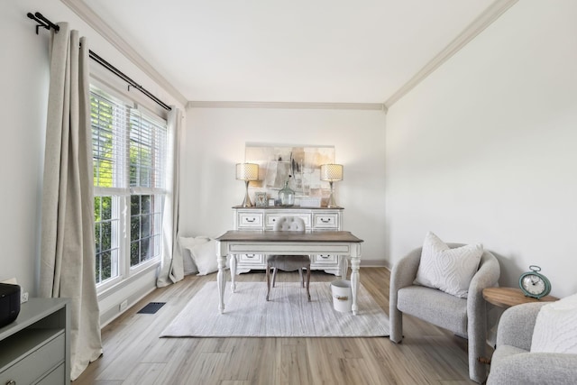 office area with visible vents, ornamental molding, and wood finished floors