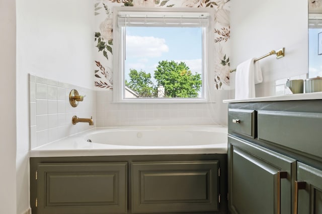 full bathroom featuring a bath and vanity