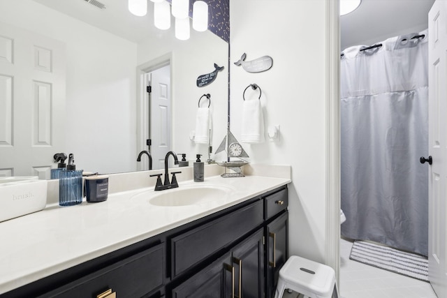 bathroom featuring toilet, a shower with curtain, and vanity
