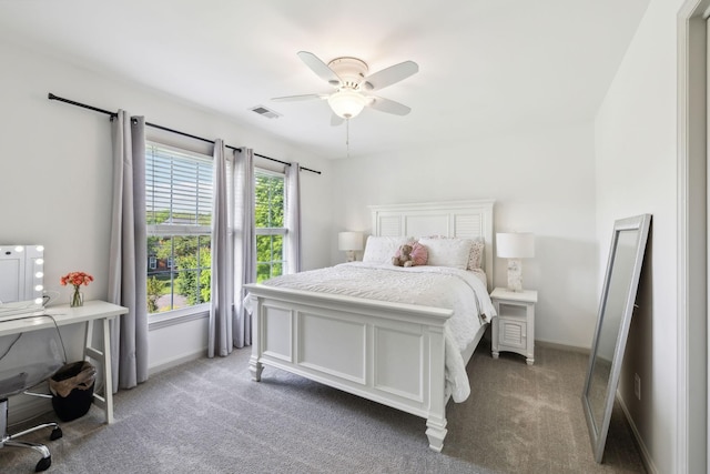 bedroom with carpet flooring, a ceiling fan, baseboards, and visible vents