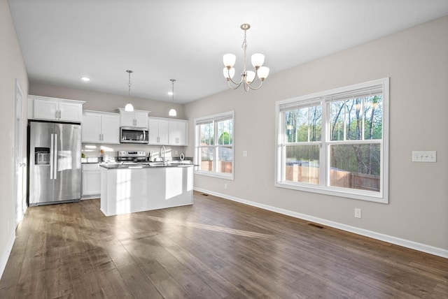 kitchen with baseboards, visible vents, appliances with stainless steel finishes, and dark wood-style flooring