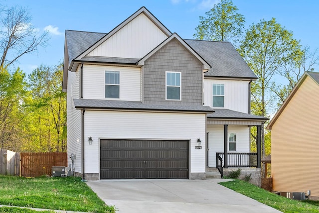 view of front facade featuring concrete driveway, a shingled roof, an attached garage, fence, and a porch