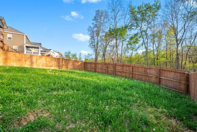 view of yard with a fenced backyard