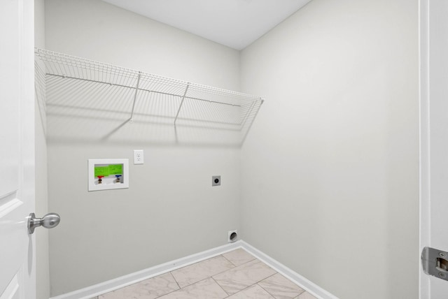 laundry area featuring hookup for a washing machine, electric dryer hookup, marble finish floor, baseboards, and laundry area