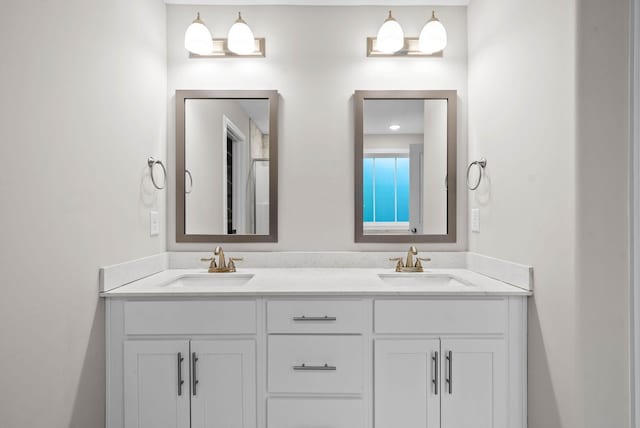 bathroom featuring double vanity and a sink