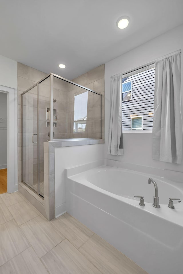 698 Conifer Dr, Spring Hill, TN 37174 - full bath featuring a bath, a shower stall, and recessed lighting