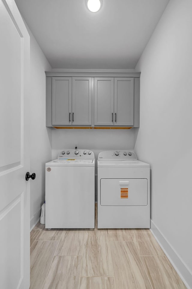 698 Conifer Dr, Spring Hill, TN 37174 - washroom featuring washer and dryer, cabinet space, and baseboards