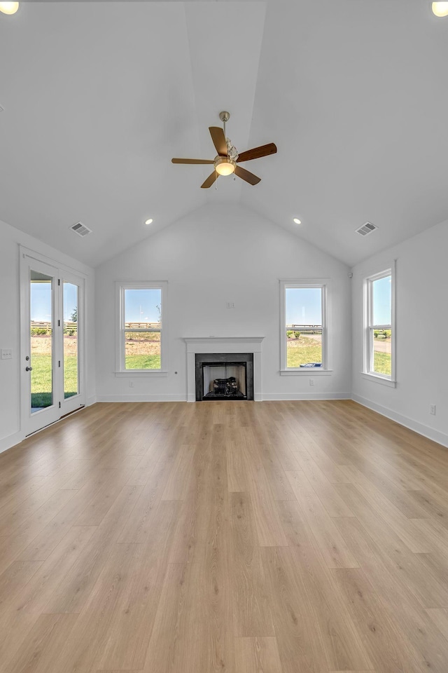 698 Conifer Dr, Spring Hill, TN 37174 - unfurnished living room with ceiling fan, light wood finished floors, vaulted ceiling, healthy amount of natural light, and a fireplace