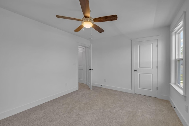 698 Conifer Dr, Spring Hill, TN 37174 - unfurnished bedroom featuring light colored carpet, baseboards, and ceiling fan