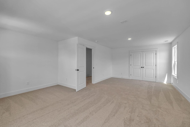 698 Conifer Dr, Spring Hill, TN 37174 - unfurnished bedroom featuring light carpet, recessed lighting, baseboards, and a closet
