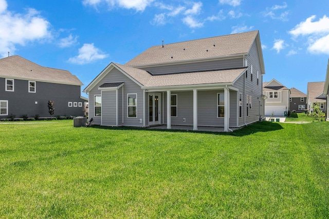 698 Conifer Dr, Spring Hill, TN 37174 - rear view of property with a yard, central air condition unit, and roof with shingles