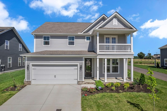 698 Conifer Dr, Spring Hill, TN 37174 - view of front of home with a porch, a balcony, concrete driveway, a front lawn, and a garage