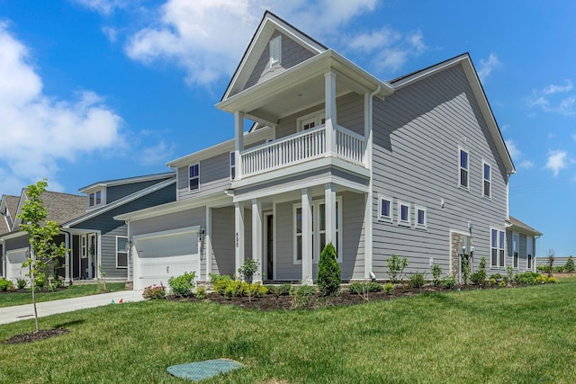 698 Conifer Dr, Spring Hill, TN 37174 - traditional-style house with a balcony, covered porch, a front yard, concrete driveway, and an attached garage