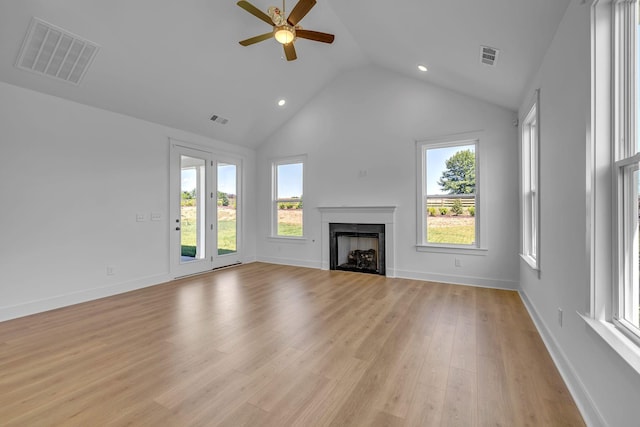 698 Conifer Dr, Spring Hill, TN 37174 - unfurnished living room featuring a ceiling fan, vaulted ceiling, light wood-style floors, a fireplace, and recessed lighting