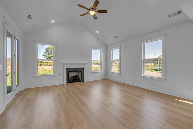 698 Conifer Dr, Spring Hill, TN 37174 - unfurnished living room with vaulted ceiling, a ceiling fan, a fireplace, healthy amount of natural light, and light wood-style floors