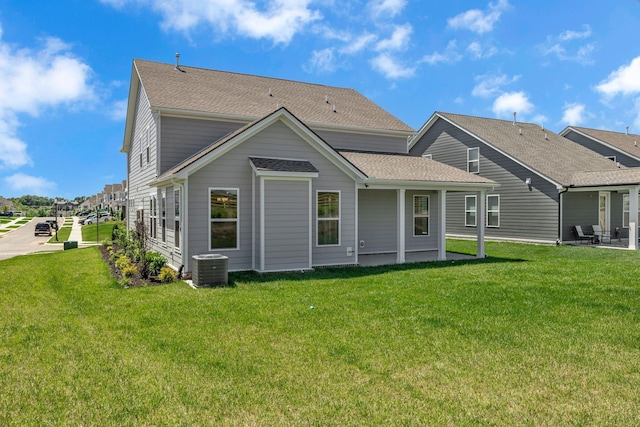 698 Conifer Dr, Spring Hill, TN 37174 - back of house with a yard, central air condition unit, a shingled roof, and a patio area