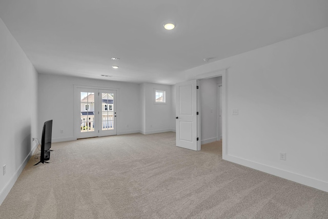 698 Conifer Dr, Spring Hill, TN 37174 - unfurnished living room with light carpet, baseboards, and recessed lighting