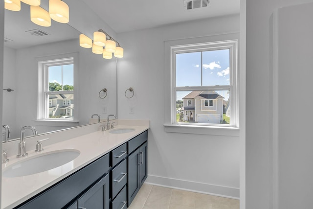 698 Conifer Dr, Spring Hill, TN 37174 - full bath with tile patterned flooring, double vanity, and baseboards
