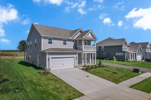 698 Conifer Dr, Spring Hill, TN 37174 - view of front of home featuring a balcony, a garage, driveway, a front lawn, and roof with shingles