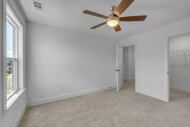 698 Conifer Dr, Spring Hill, TN 37174 - unfurnished bedroom featuring multiple windows and light carpet