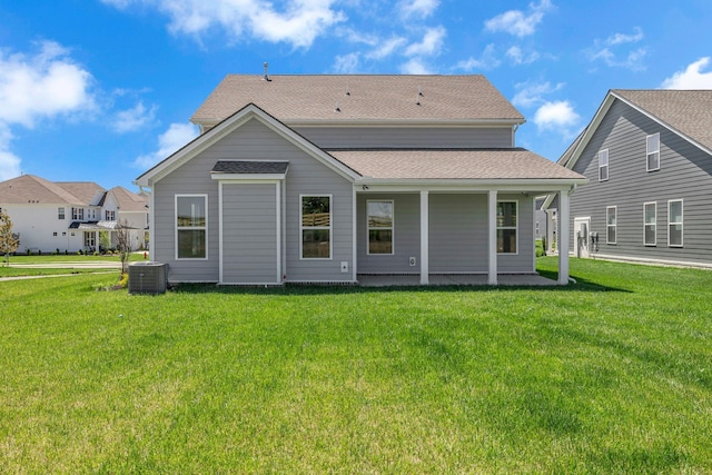 698 Conifer Dr, Spring Hill, TN 37174 - back of house with a lawn, central AC unit, and a shingled roof